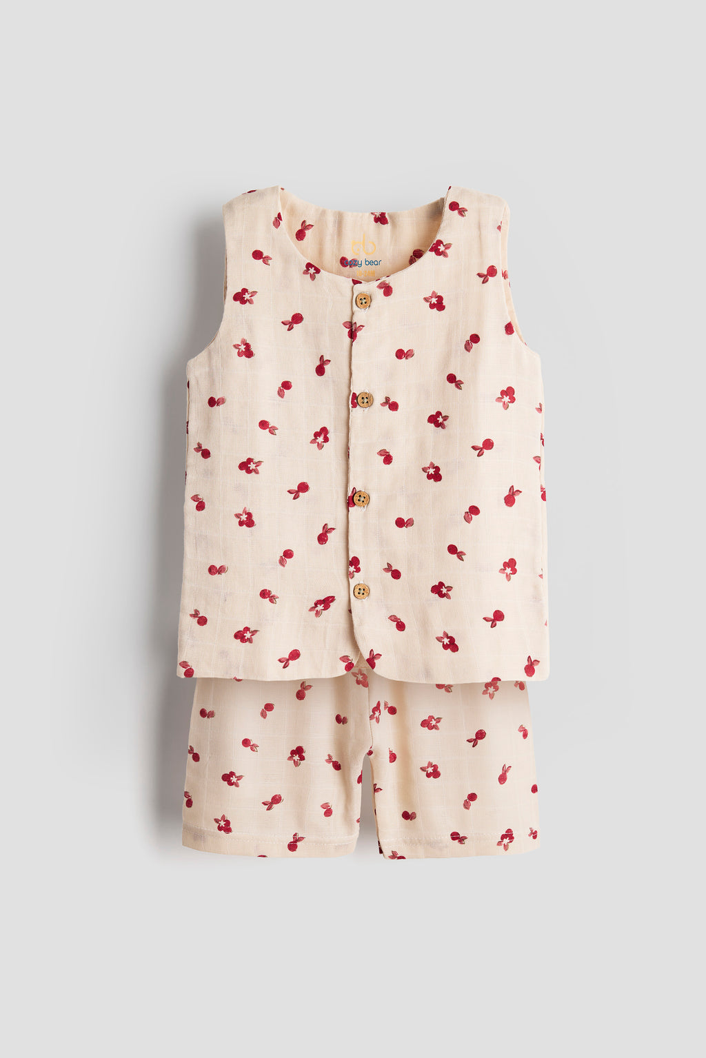 Children's outfit with a sleeveless top and shorts featuring red floral patterns on a light gray background.