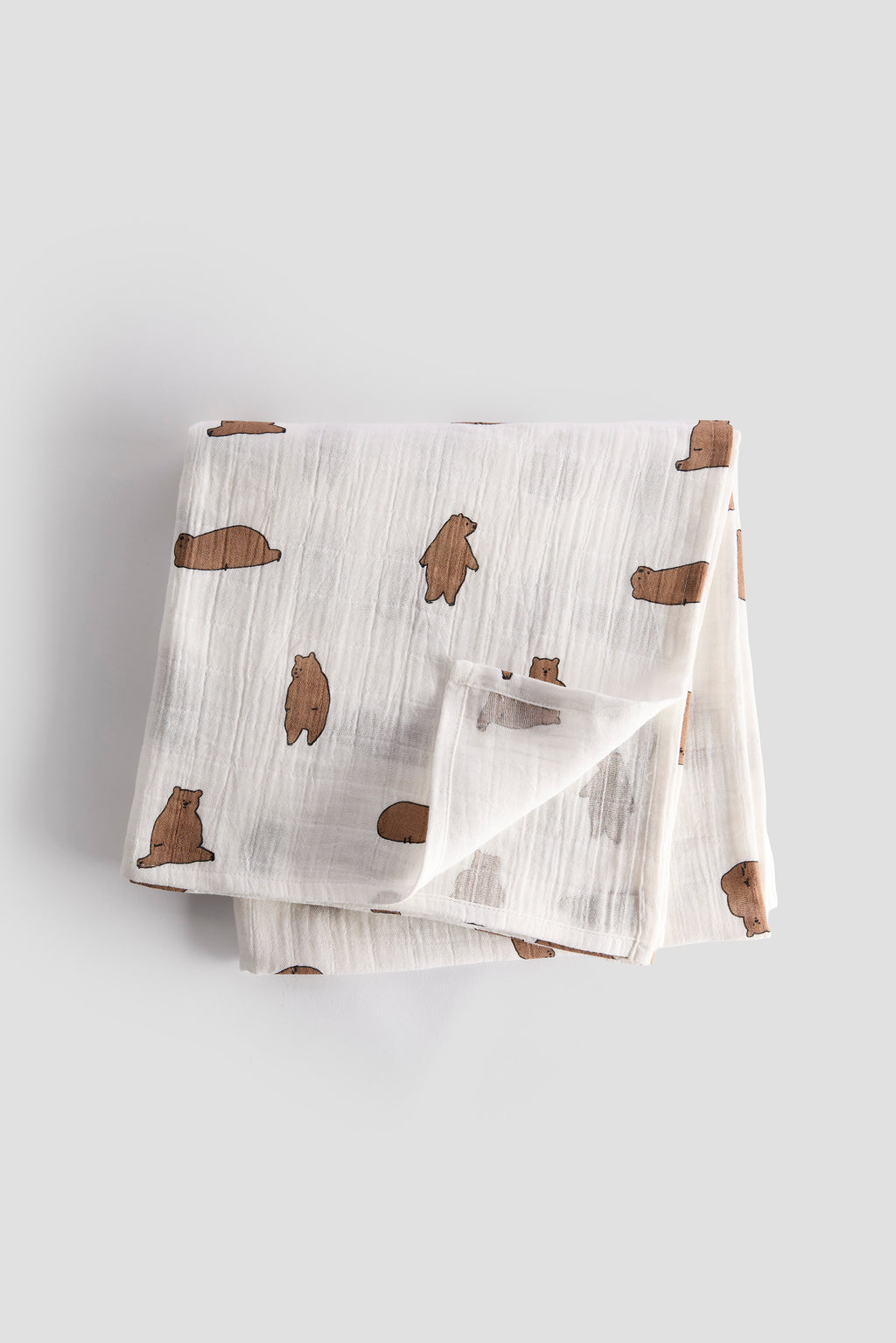 Baby blanket with bear pattern on a light gray background