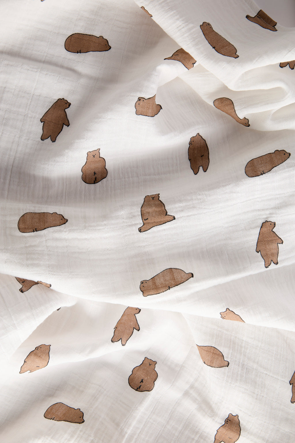 White fabric with brown bear prints