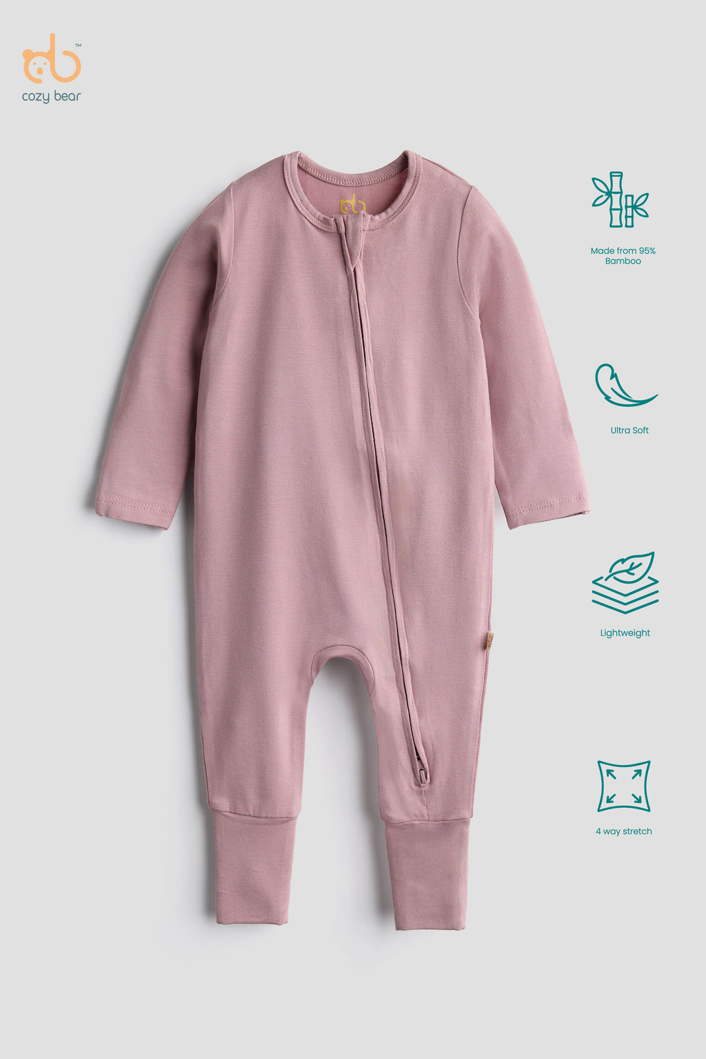 A baby long-sleeve footless zip-up sleeper in dusty pink, shown flat on a light gray background with feature icons on the right side. The brand logo 'coco bear' is visible in the top left corner.
