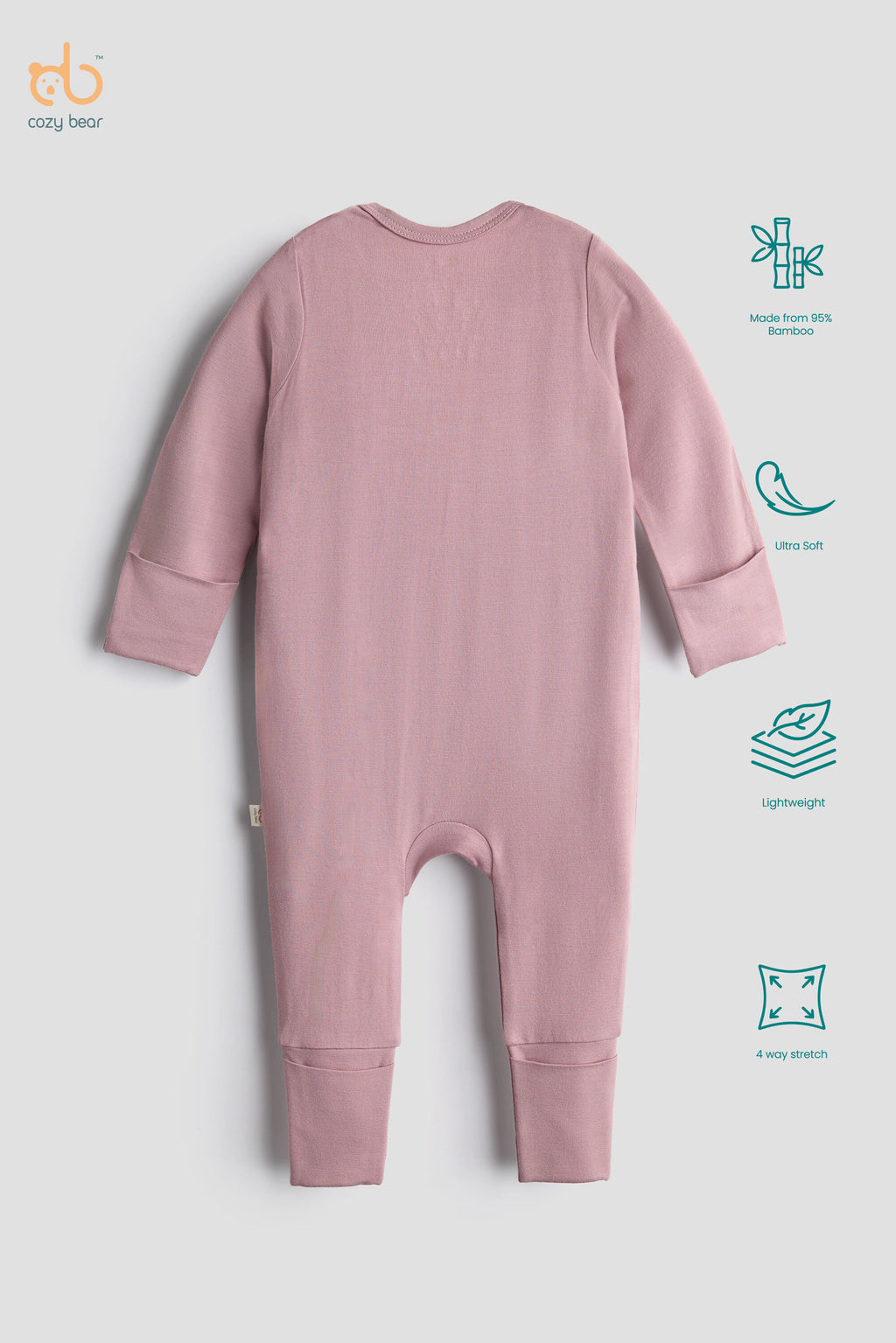 A baby long-sleeve ribbed footless romper in dusty pink, shown from the back on a light gray background with product feature icons on the right.
