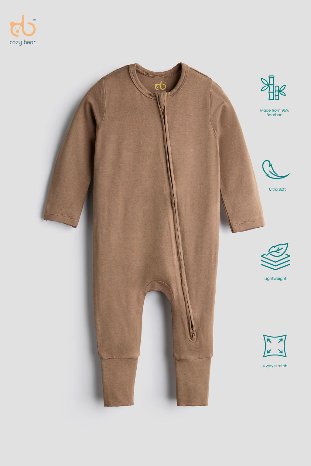 A baby long-sleeve footless zip-up sleeper in a warm tan color, shown on a light gray background with feature icons on the right side.