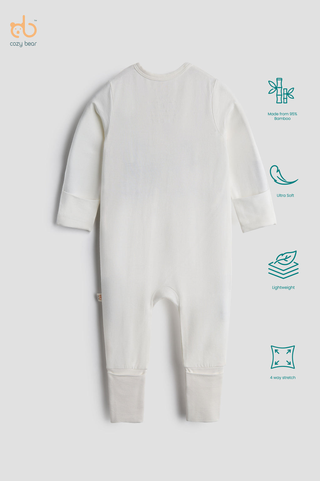 A baby long-sleeve footless one-piece romper in off-white, shown from the back on a light gray background. The image includes feature callout icons on the right side and the 'crazy bear' brand logo in the top left corner.
