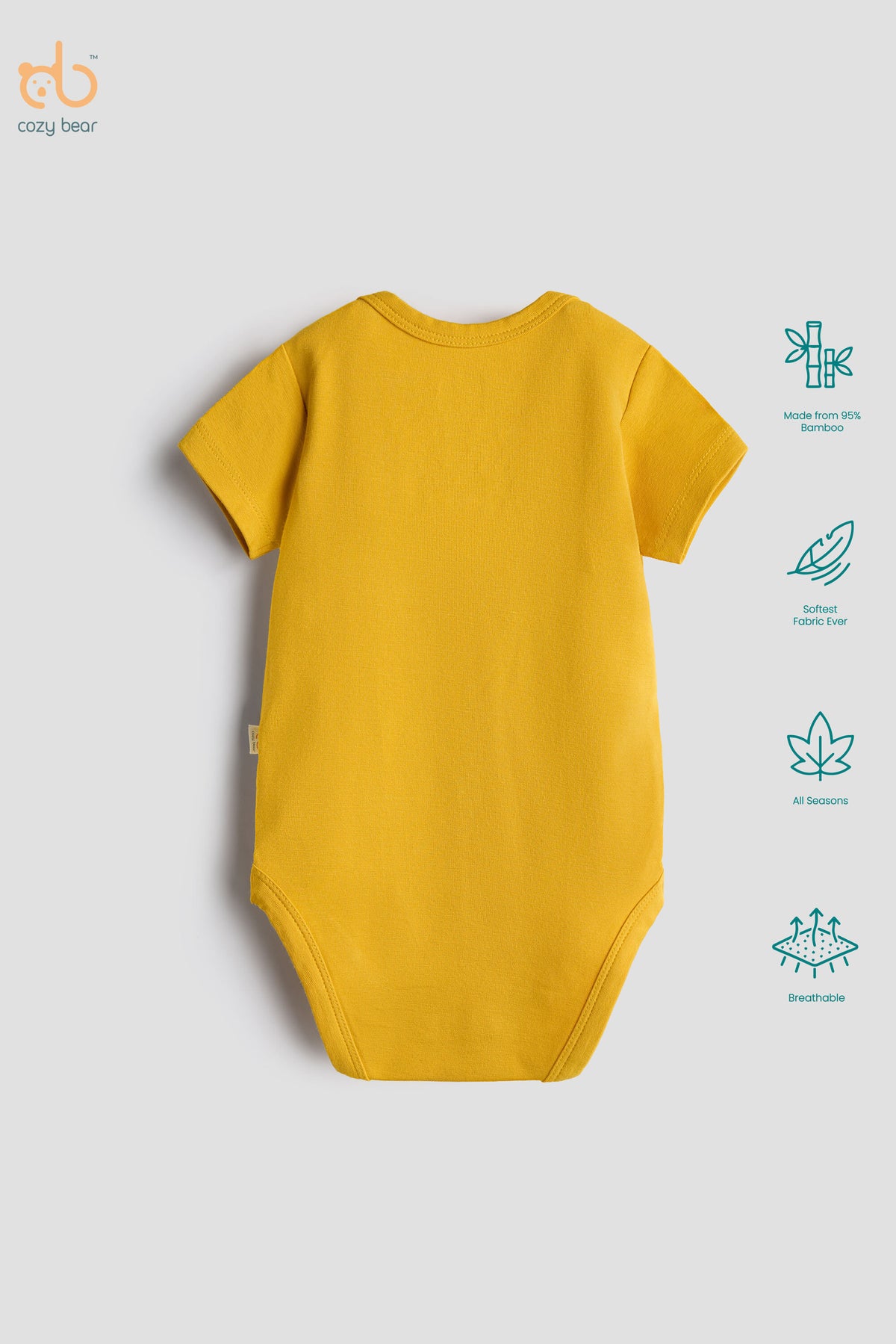 A yellow short-sleeve baby bodysuit shown from the back on a light gray background, with a small side tag and a vertical list of feature icons on the right.