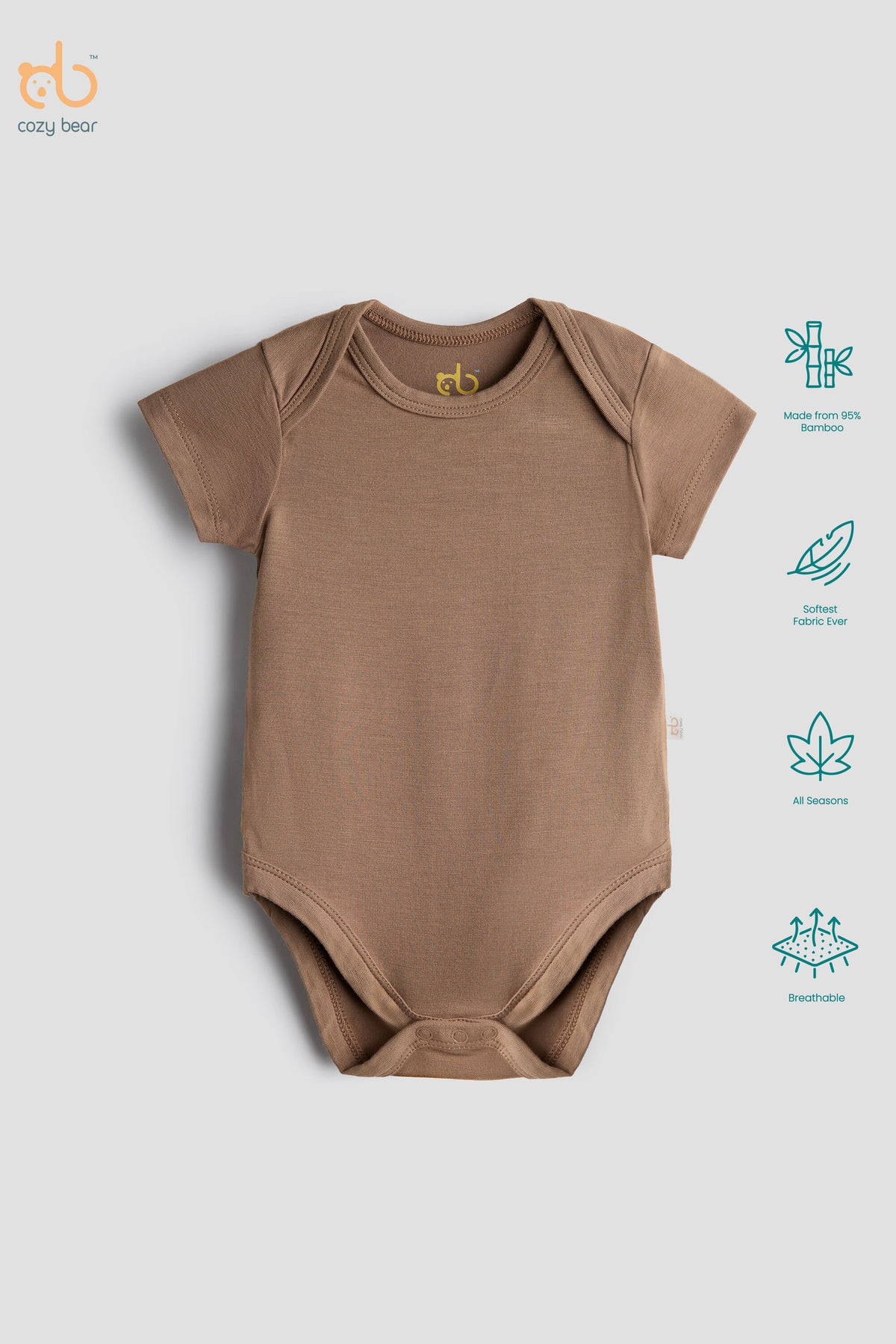 A short-sleeve baby bodysuit in a warm taupe-brown color, displayed flat against a light gray background. The image includes a 'cozy bear' brand logo in the top-left corner and a vertical list of product feature icons on the right side.