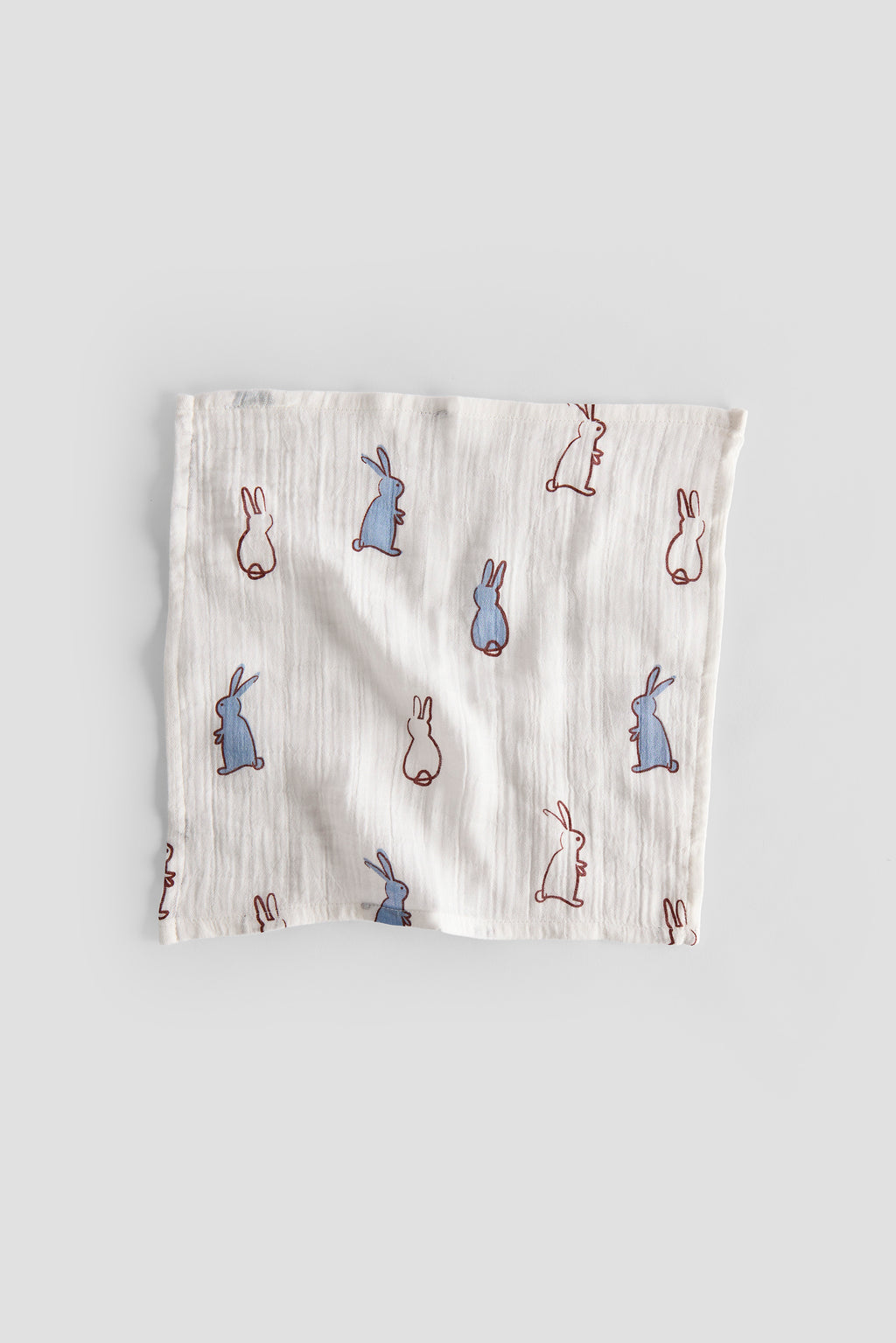 Muslin cloth with rabbit pattern on a gray background
