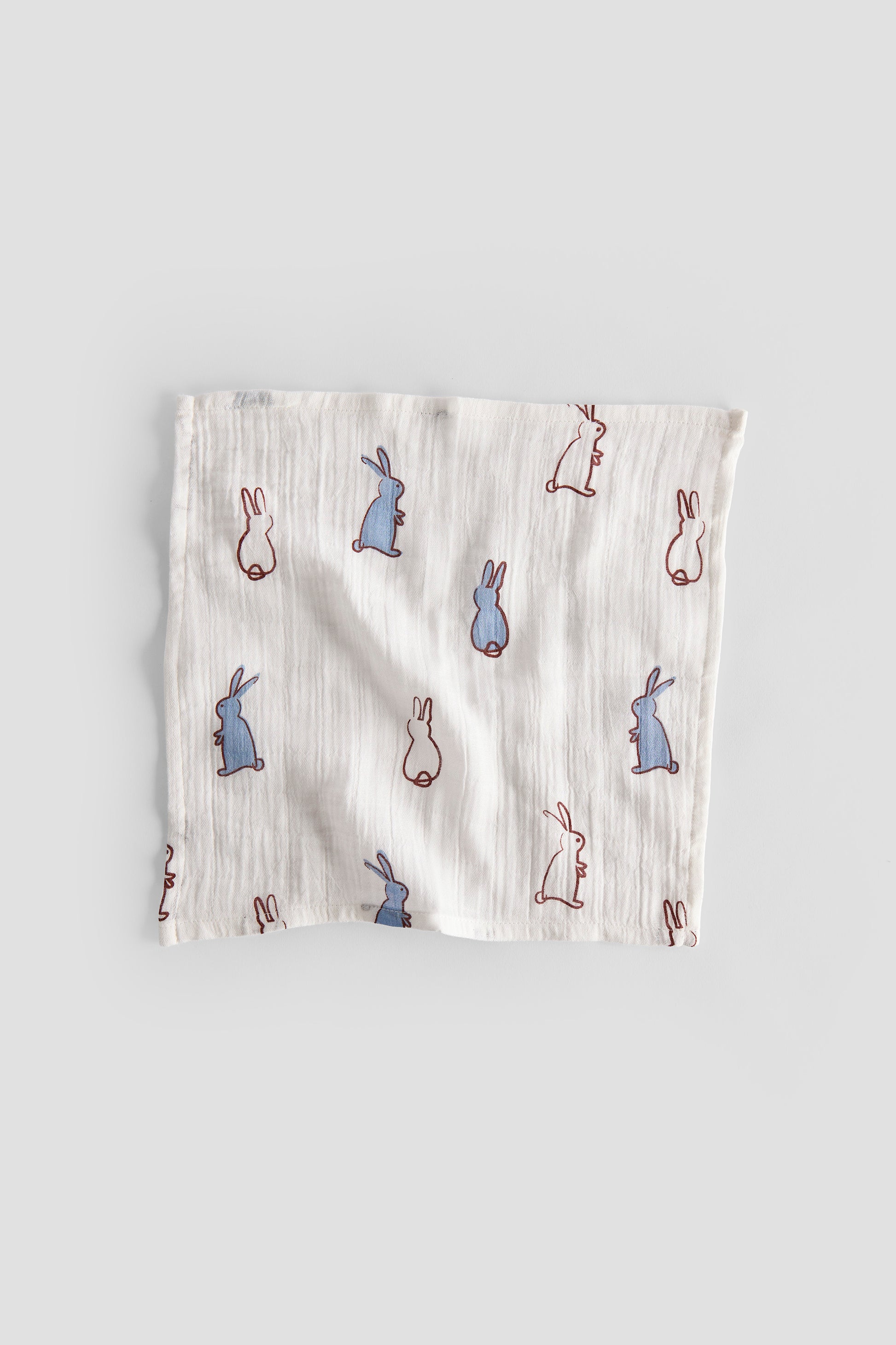 Muslin cloth with rabbit pattern on a gray background