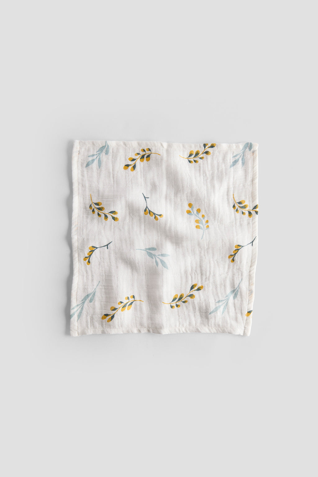 Floral patterned baby blanket on a light gray background