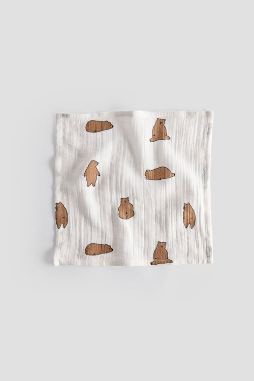 Baby blanket with brown bear pattern on a light gray background