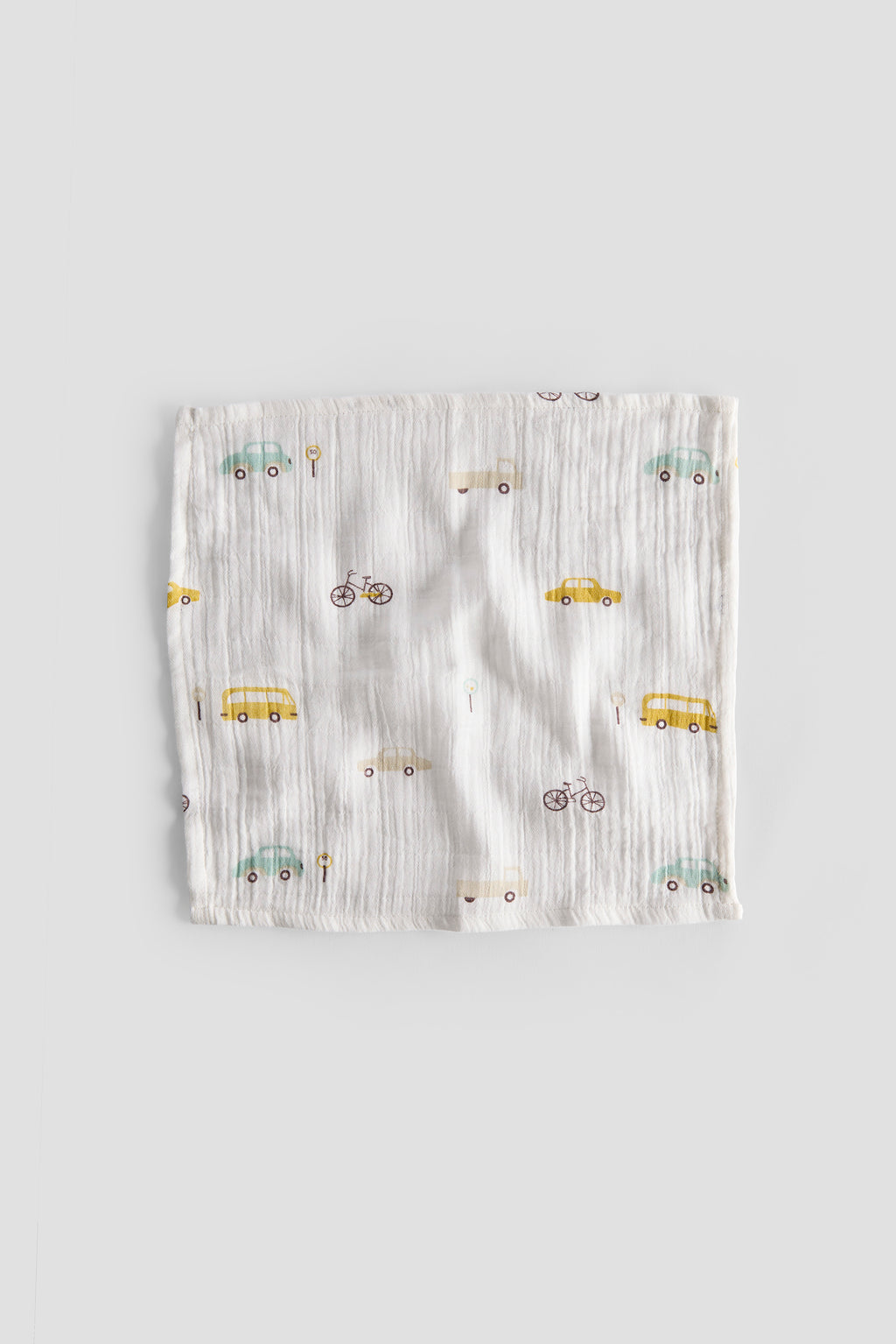 Baby romper with vehicle pattern on a light gray background