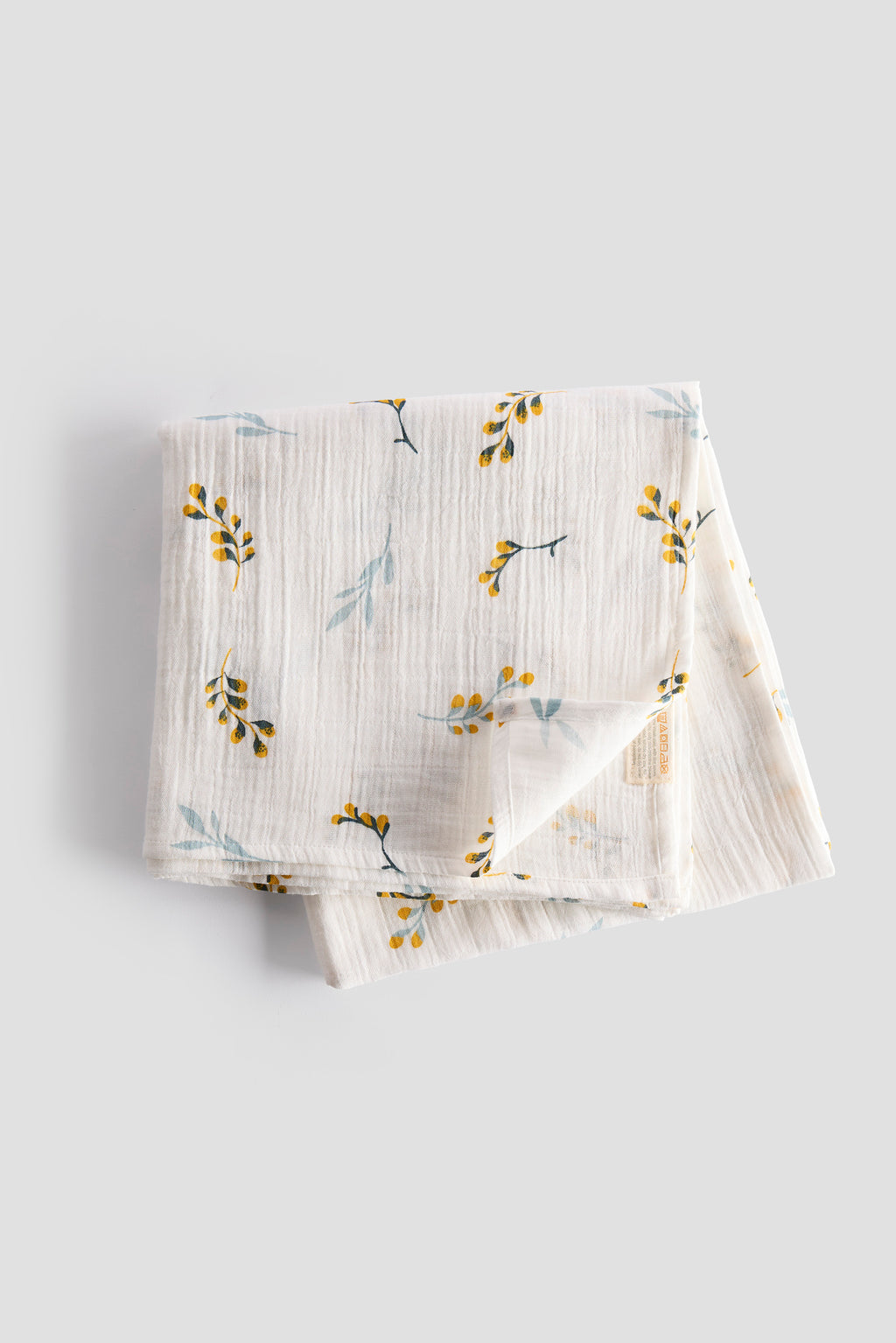 Folded fabric with floral pattern on a light gray background