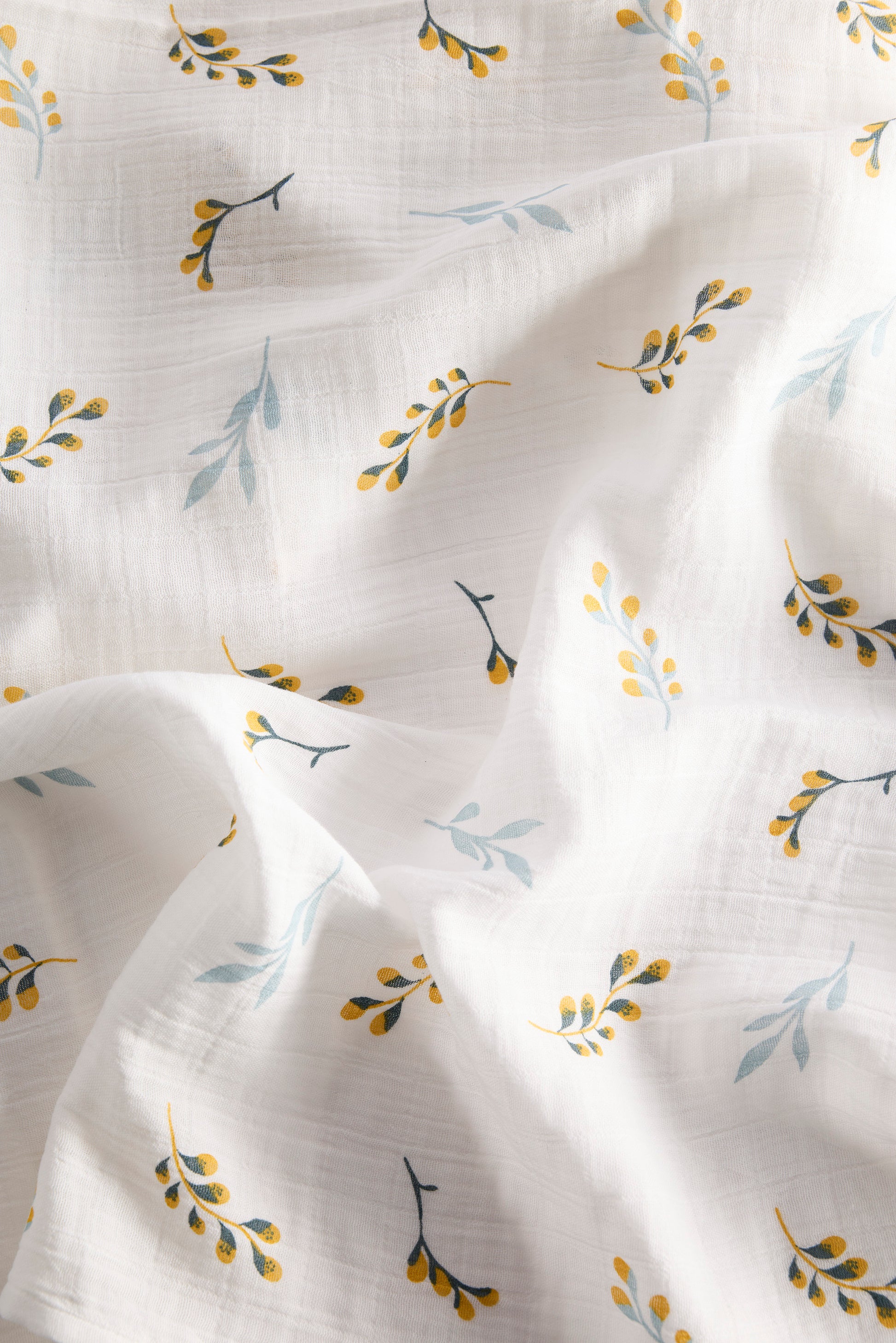 Floral patterned fabric with small leaves on a white background