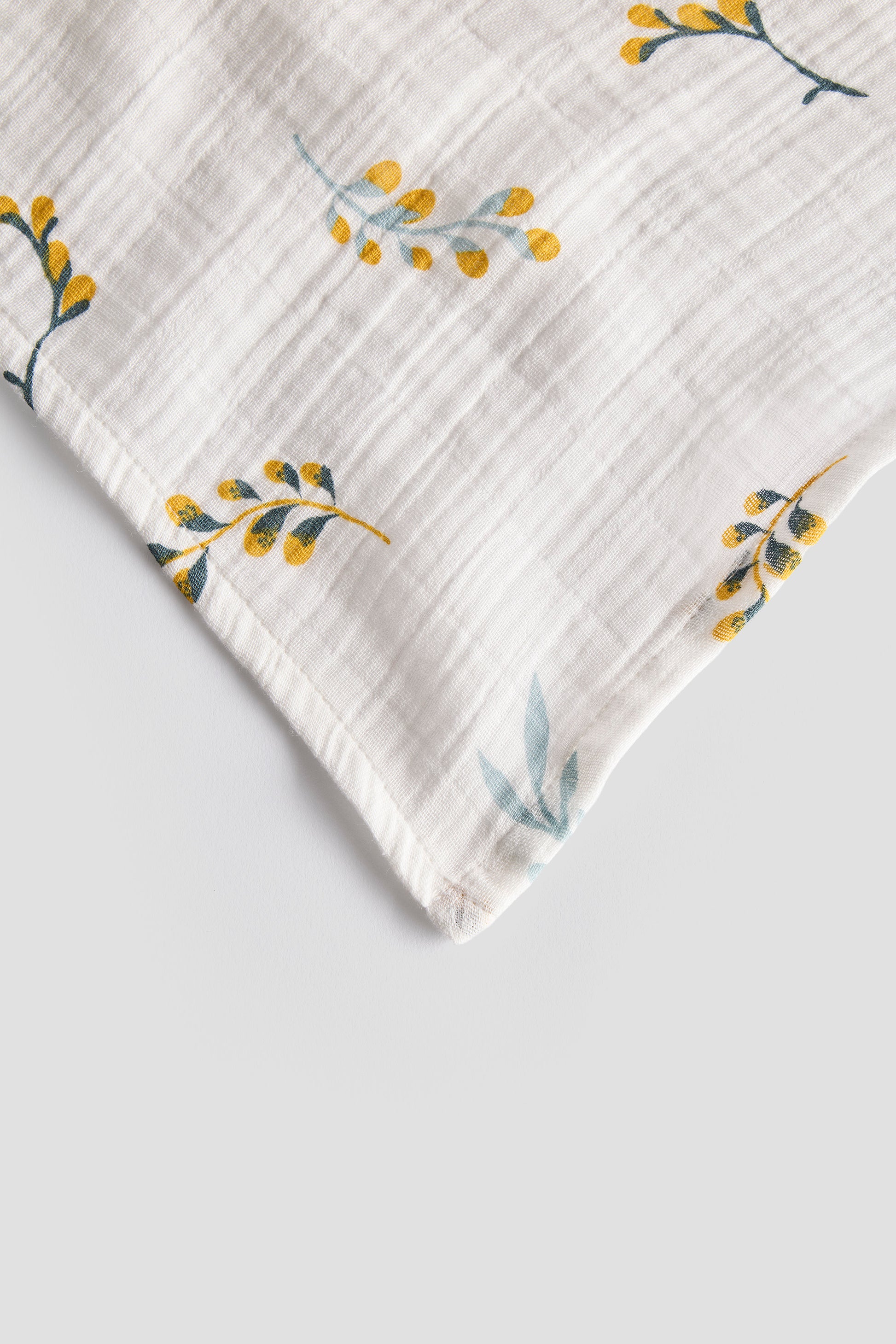 Fabric with floral pattern on a light gray background