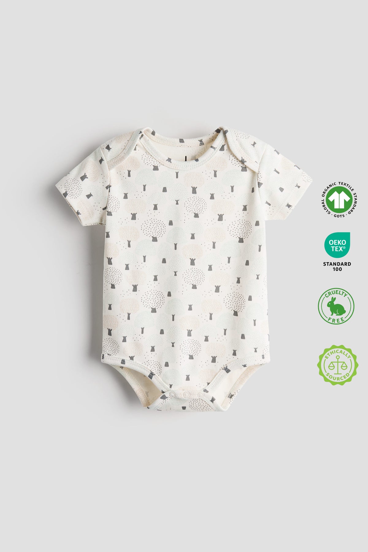 Baby onesie with a pattern on a gray background