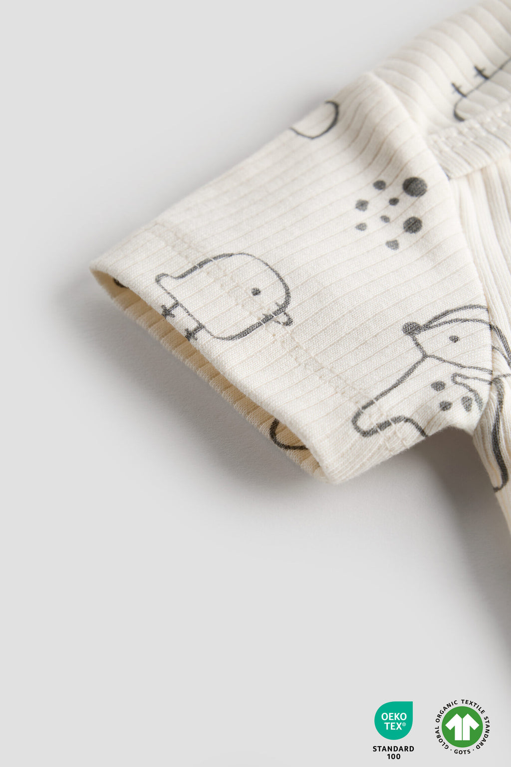 Folded fabric with animal pattern on a light gray background