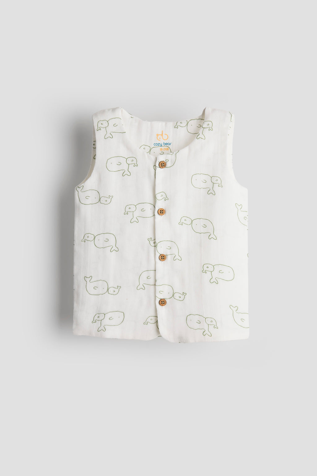 White sleeveless shirt with whale pattern on a light gray background