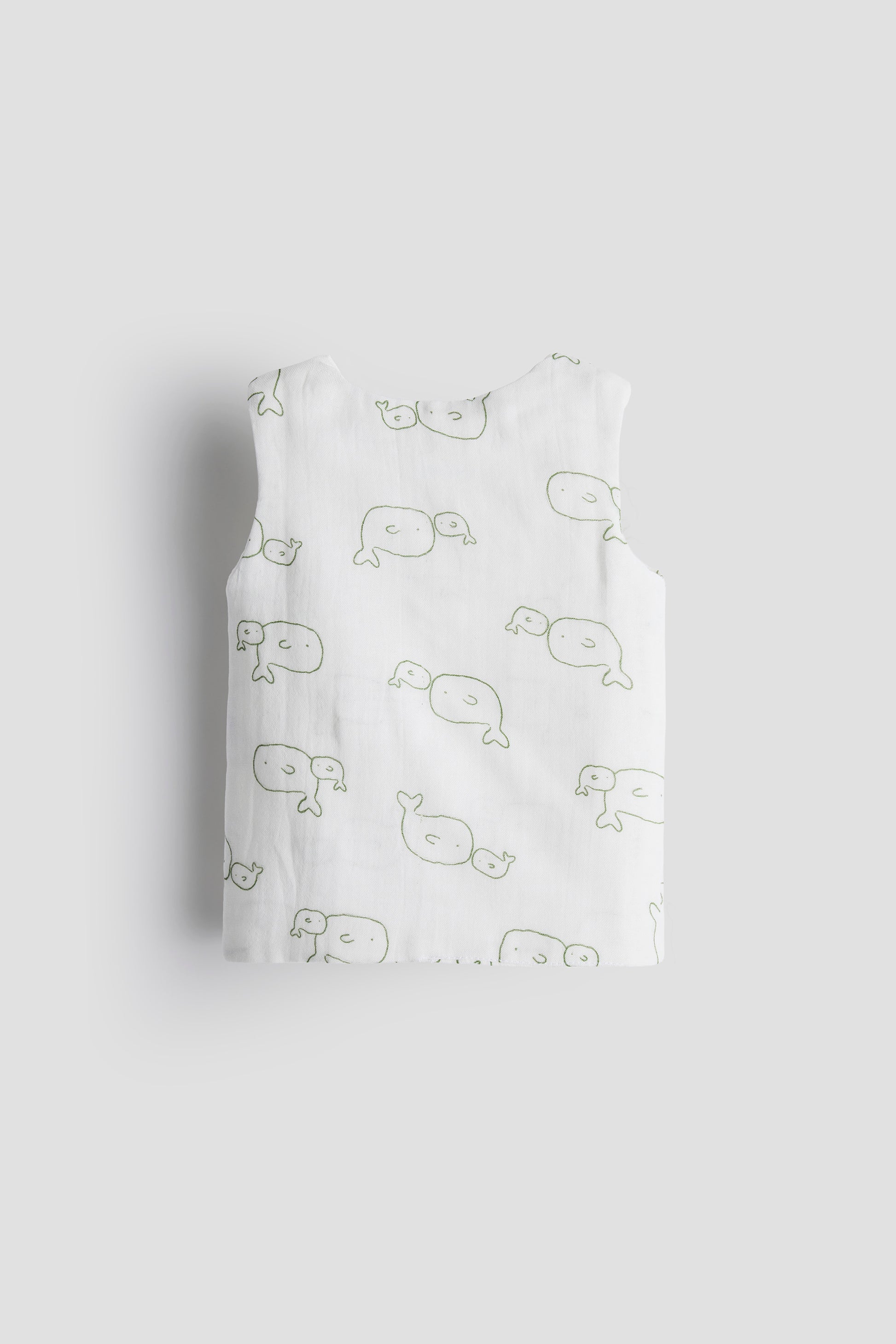 Pack of baby pants with whale pattern on a light gray background